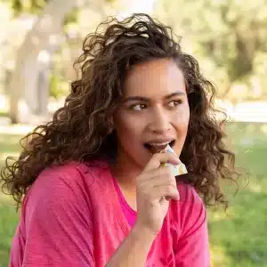 li-woman-eating-barjpg-pdp-w875h783 - NutriHerbs